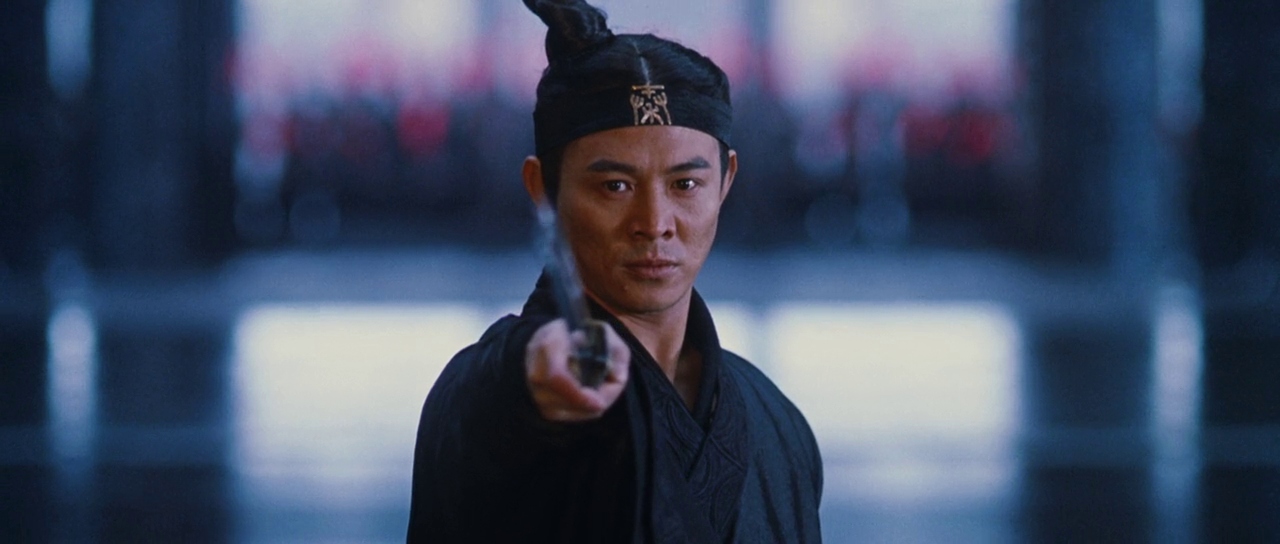 Jet Li points a sword at the camera in Hero