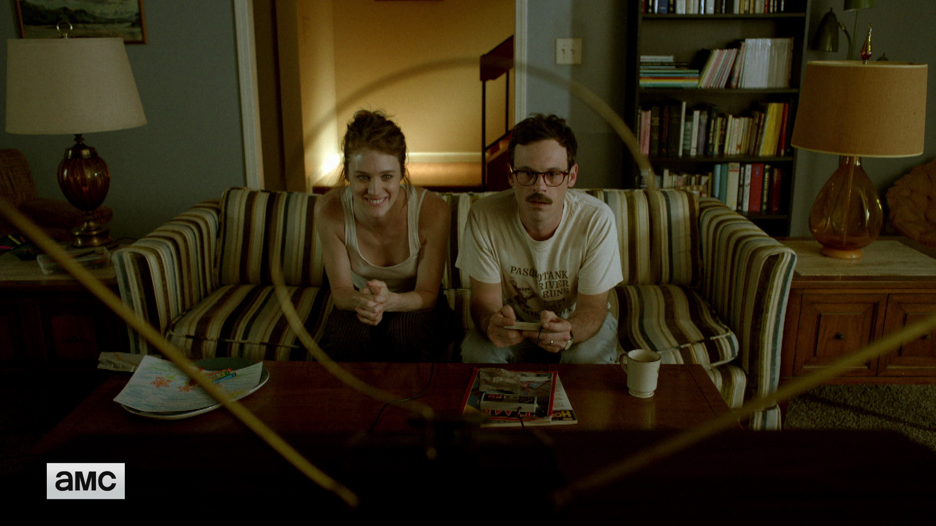 Cameron and Gordon sitting and playing Super Mario NES in a still from Halt and Catch Fire
