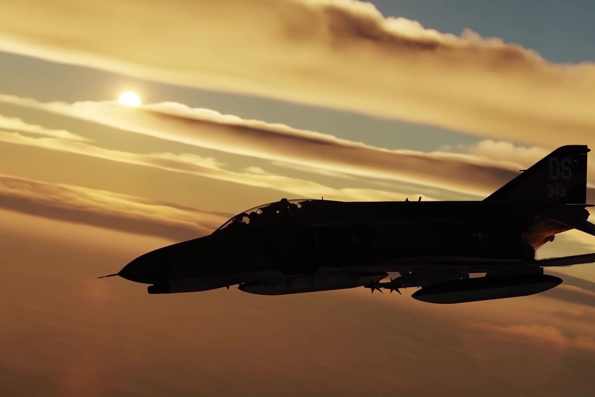 An F-4 Phantom silhouetted against a setting sun.